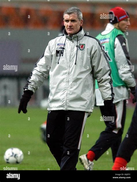 EDITORIAL USE ONLY Wales' team manager Mark Hughes during training in ...