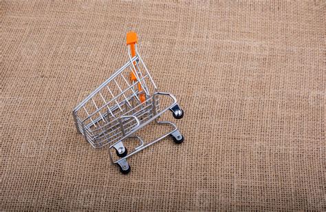 Shopping cart on canvas background 14552083 Stock Photo at Vecteezy