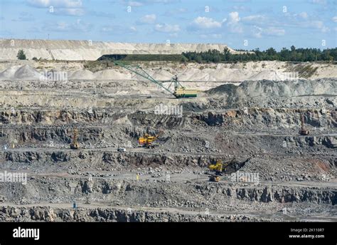 Technique works in a large mining quarry Stock Photo - Alamy