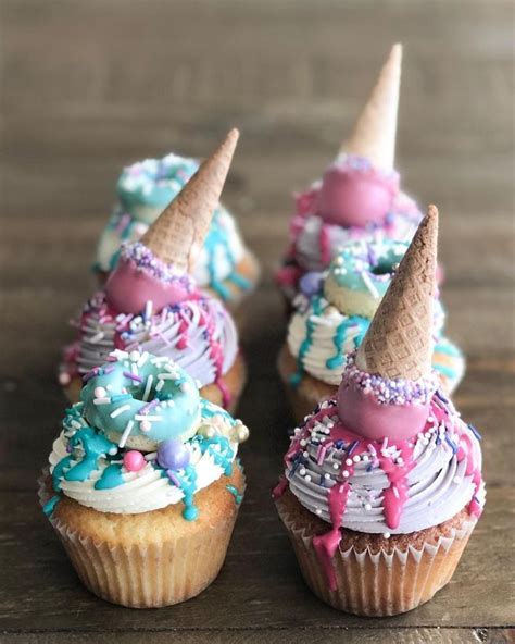 adorable cupcakes decorated with miniature ice cream cones and donuts! Perfect for a candy lan ...