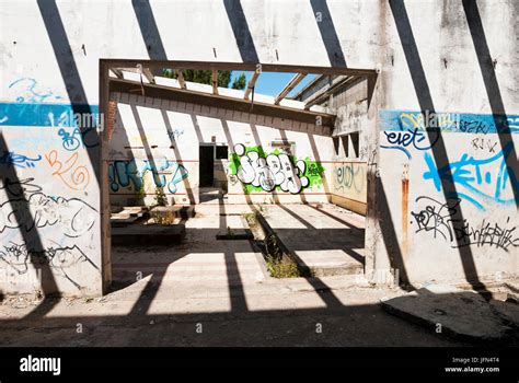 Interior of abandoned factory building, full of graffiti Stock Photo ...