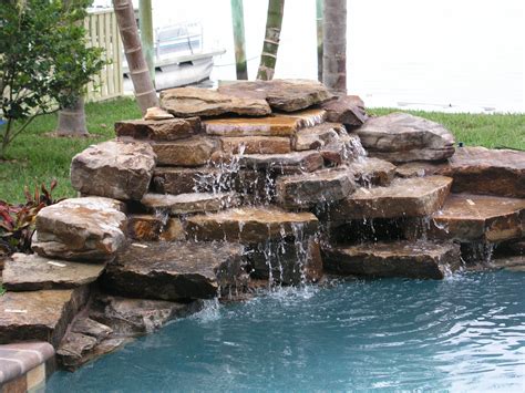 Rock Water Fountains | Waterfalls | Swimming pool waterfall, Pool ...