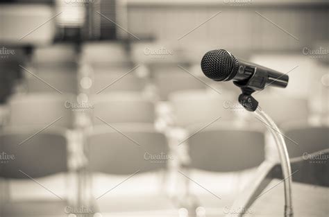 Microphone on the speech podium ~ Arts & Entertainment Photos ~ Creative Market