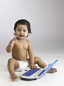 Stock Photography of Indian baby girl wearing diaper with toy laptop dpl1950 - Search Stock ...