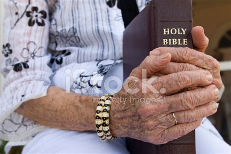 Hands Holding Bible Stock Photo | Royalty-Free | FreeImages