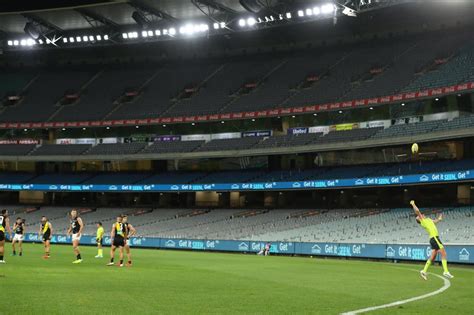 AFL season begins in empty Melbourne stadium due to coronavirus ...