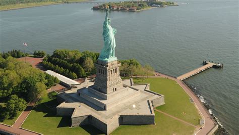 'Refugees Welcome' sign hung from Statue of Liberty