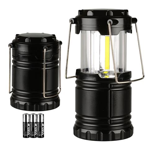 a black lantern with two batteries attached to it