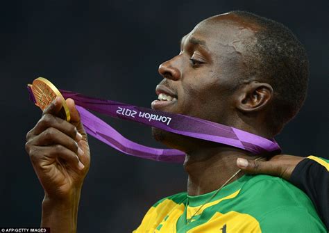 London 2012 Olympics: Usain Bolt grabs a camera and snaps his own ...