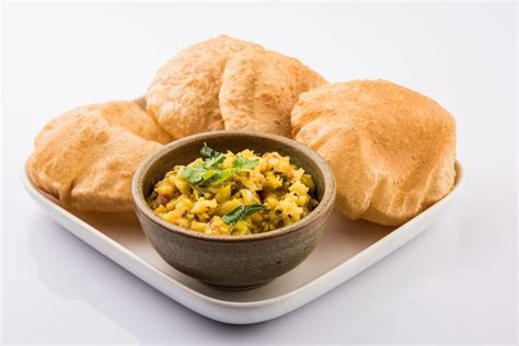 Premium Photo | Puri Bhaji - Indian semi dry Potato Spicy recipe also known as Batata or Aloo ki ...