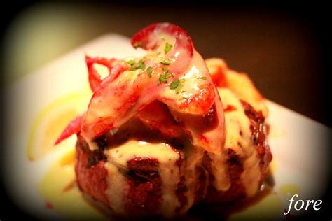 The most appropriate way to eat a steak, Fore Style! Topped with lobster & hollandaise sauce ...