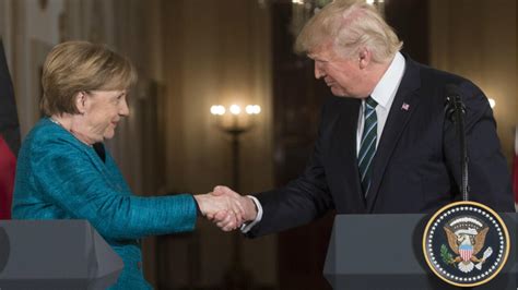 Trump presses Merkel on NATO spending as he backs Alliance at first ...