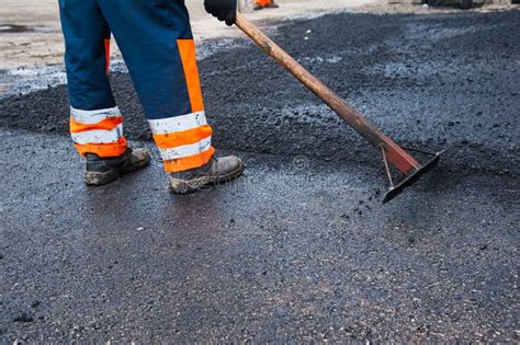 Workers on a Road Construction Stock Photo - Image of shovel, bitumen: 98890650