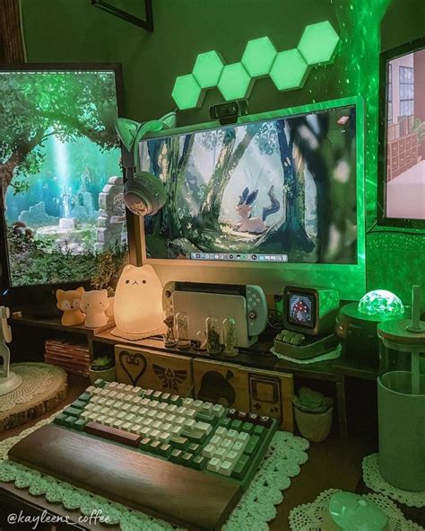 a computer desk with two monitors and a keyboard on it, in front of green lights