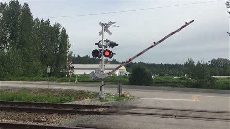 Double CREX locomotive passing a railway crossing in Langley, BC - YouTube