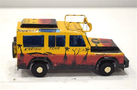 African Safari Recycled Red Tin Truck Pop Up Roof Tanzania Toy Safari Truck