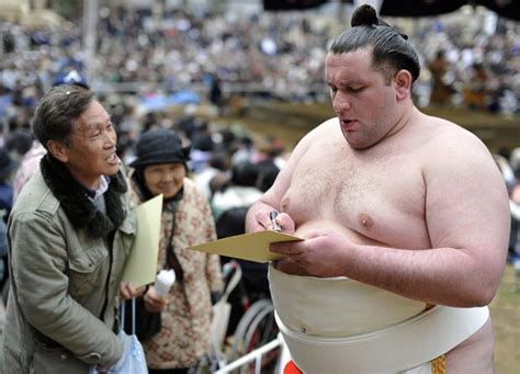 Sumo wrestlers perform at a ceremonial spring festival at the Yasukuni Shrine in Tokyo