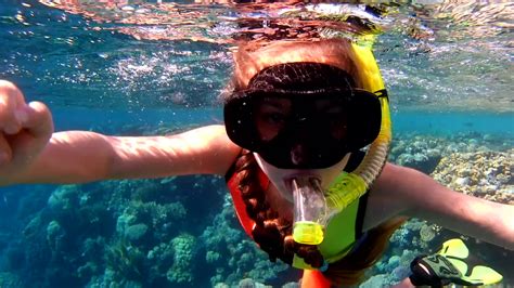 young-girl-snorkeling-in-the-red-sea-the-child-with-pleasure-swimming-in-clean-sea-water ...