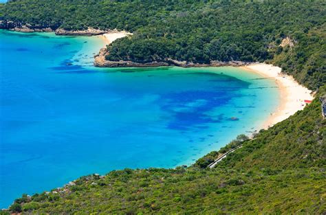 Set in the Parque Natural Arrábida near Setúbal, the idyllic Praia de Galapinhos is one of the ...