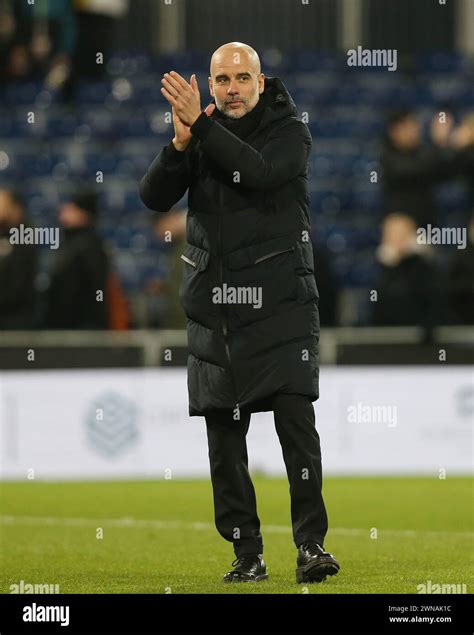 Josep Guardiola Manager of Manchester City applauds the Manchester City ...