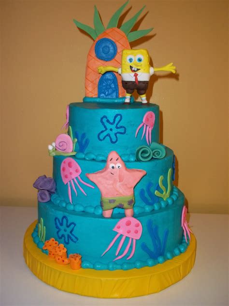 a three tiered cake decorated with spongebob characters