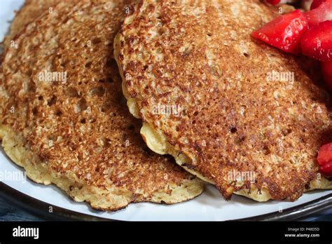 Homemade Oat wheat Bran Pancakes served with fresh strawberries and ...