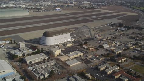 5K stock footage aerial video approach Moffett Field, Hangar One, NASA ...