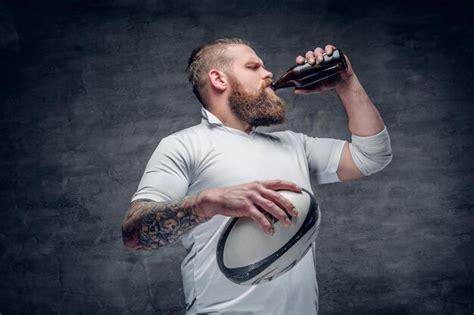 Free Photo | Portrait of bearded rugby player with tattoos on his arms