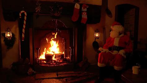 Santa Claus Sitting and Relaxing at the Crackling Christmas Fireplace ...