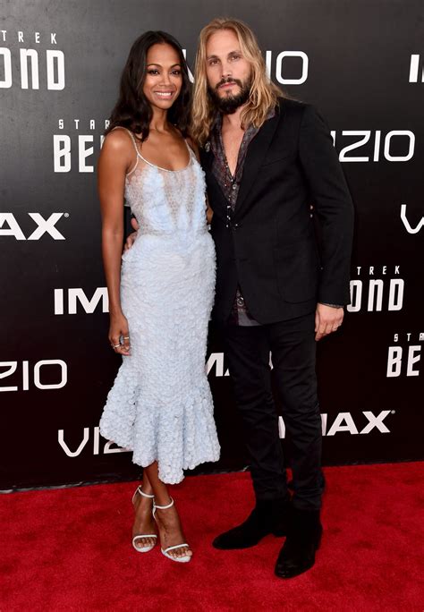 Zoe Saldana celebrates a sweet moment with her husband at the "Star Trek" premiereHelloGiggles