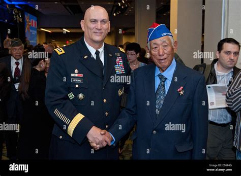 U.S. Army Chief of Staff Gen. Raymond T. Odierno stands next to a Nisei ...