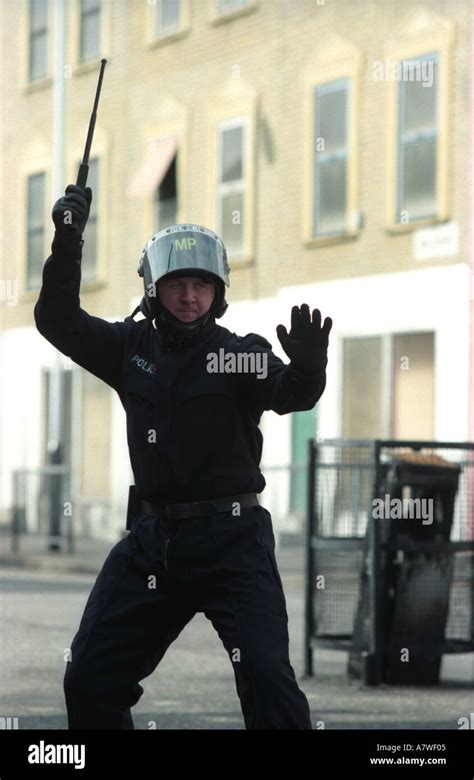 Metropolitan police officer at public order training centre with baton ...