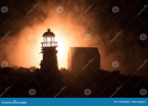 Lighthouse with Light Beam at Night with Fog. Stock Photo - Image of ...