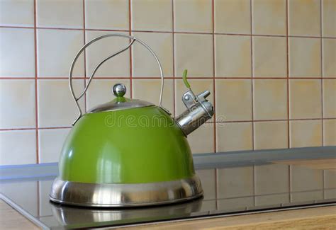 Green Kettle on Electric Stove Stock Photo - Image of kettle, heat ...