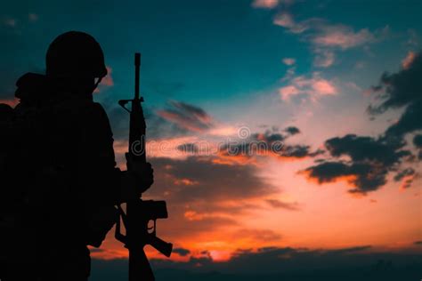 Silhouette of a Military Soldier with Weapons at Sunset Stock Photo - Image of evening ...