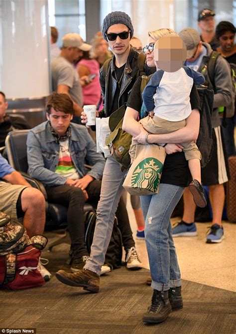 Rachel Wood cradles her son as she jets out of LAX | Daily Mail Online