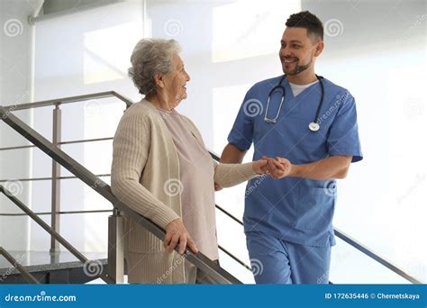 Doctor Helping Senior Patient in Hospital Stock Photo - Image of male, medicine: 172635446