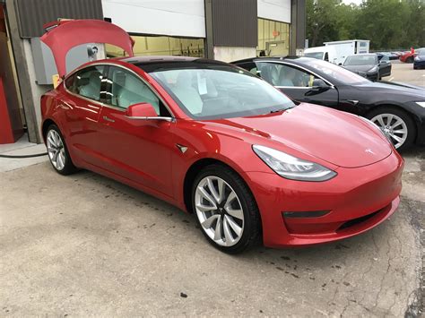 My mom’s Tesla model 3 that we got late September. Red, 19 inch wheels ...