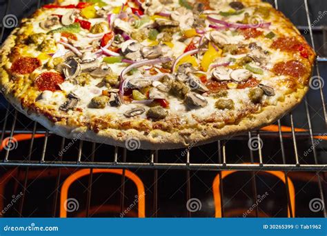 Large Fresh Pizza Baking in Oven Stock Image - Image of large, macro: 30265399