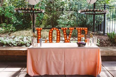 Outdoor wedding reception with LOVE marquee sign. M. Elizabeth Events ...