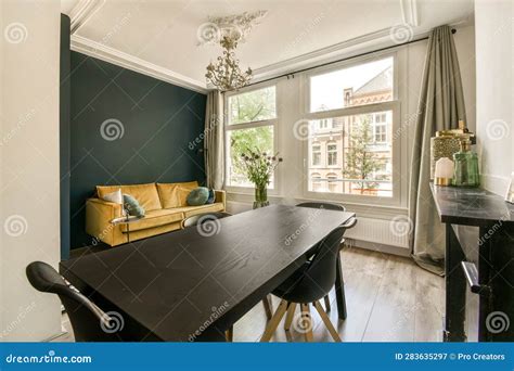 A Dining Room with a Large Window and a Table Stock Image - Image of ...