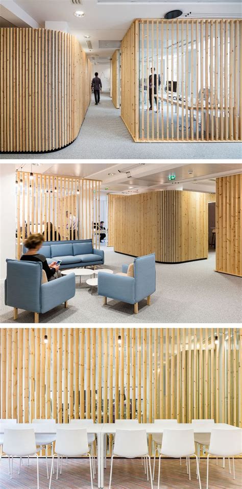 the interior of an office with wooden slats on the wall and chairs in ...