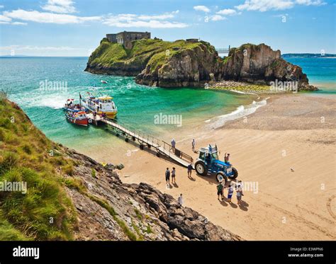 Boat trips from Castle sands, St Catherines Island, Tenby, Wales Stock Photo - Alamy