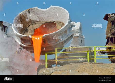 The molten slag is poured from a cup Stock Photo - Alamy