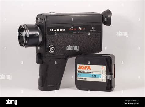 Super 8mm cine camera with a x2 zoom lens and super 8mm film cartridge Stock Photo - Alamy