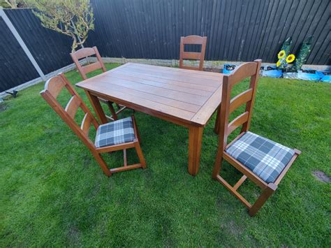 Solid Oak dining table and 4 chairs | eBay