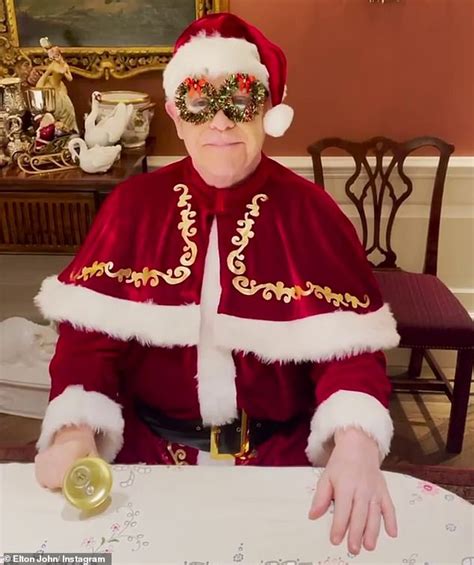 Sir Elton John steps into Christmas with tinsel wreath glasses and ...