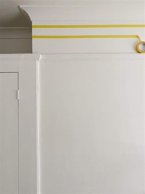 A step-by-step guide on how to paint stripes and scallops onto your walls.