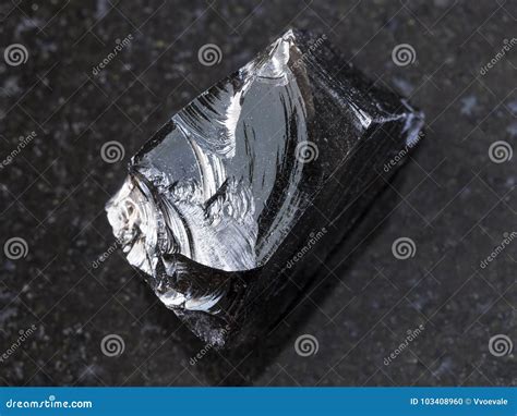 Piece of Raw Obsidian (volcanic Glass) on Dark Stock Photo - Image of dark, collection: 103408960