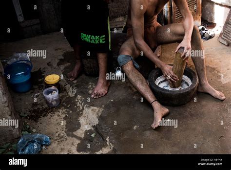 New Delhi, India. 2nd May, 2017. A young Pehlwani wrestler prepares food for other wrestlers in ...